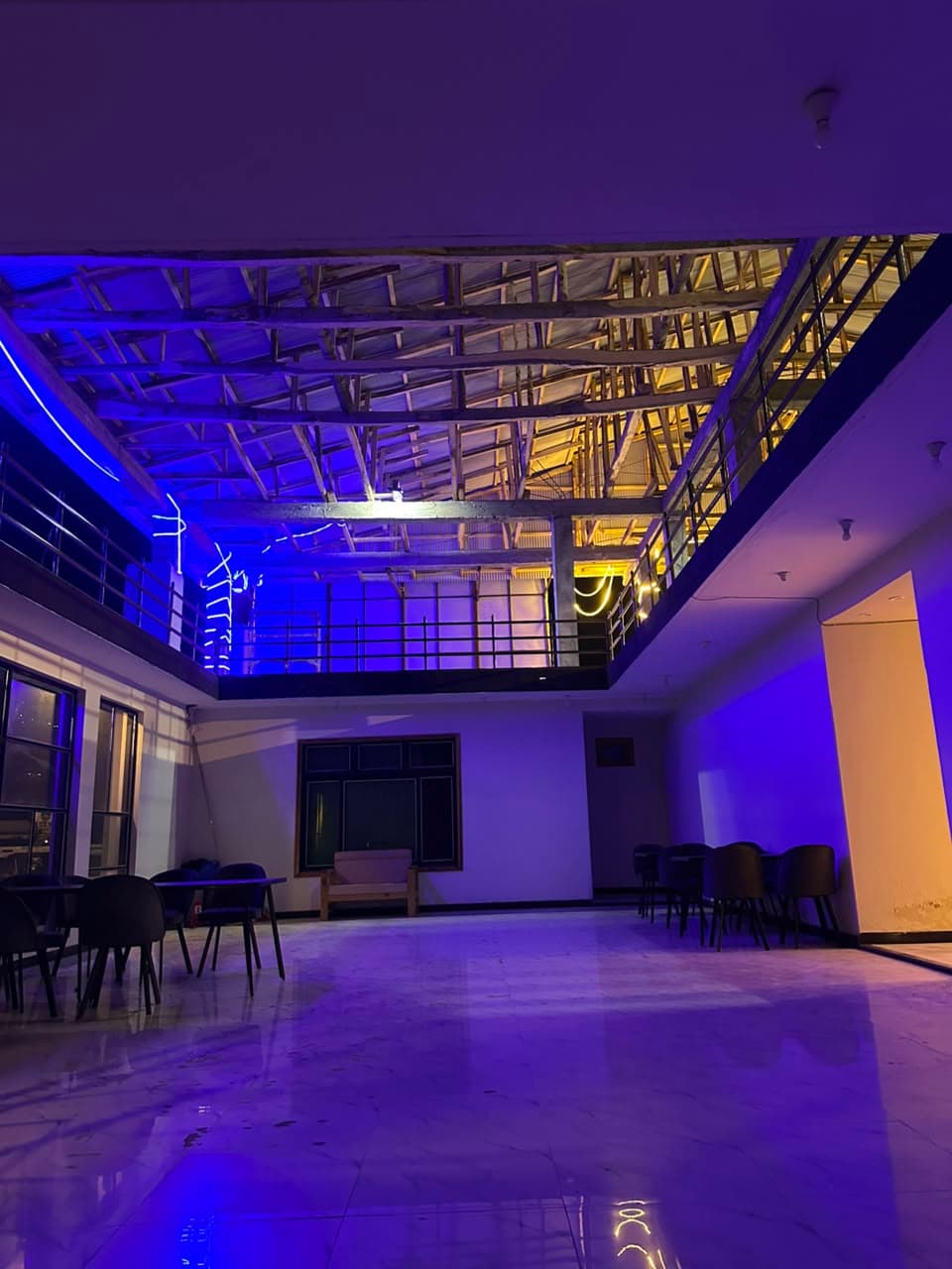 Comfort Inn Kalam open lobby area with blue ambient lighting at night