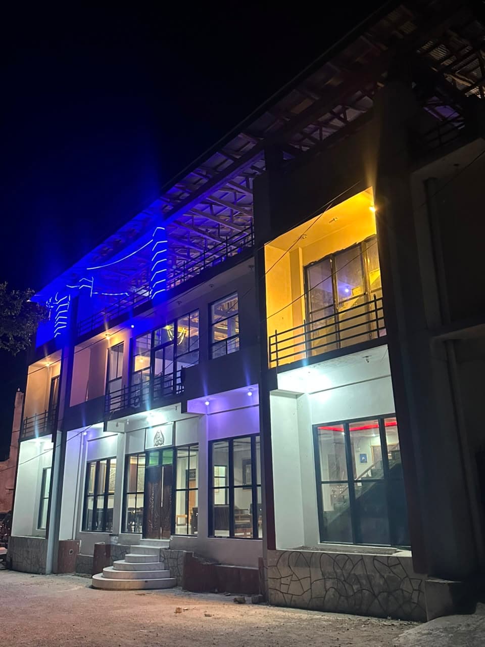 Comfort Inn Kalam hotel front facade lit up at night