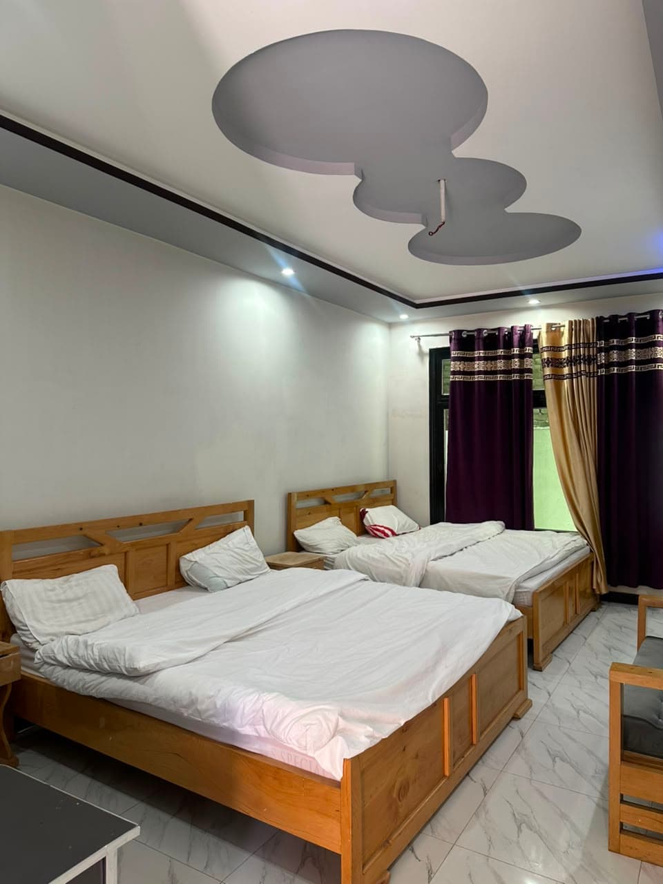 Three single bed room for families at Comfort Inn Kalam